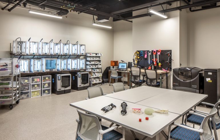 Lab full of mechanical equipment and conference table and chairs