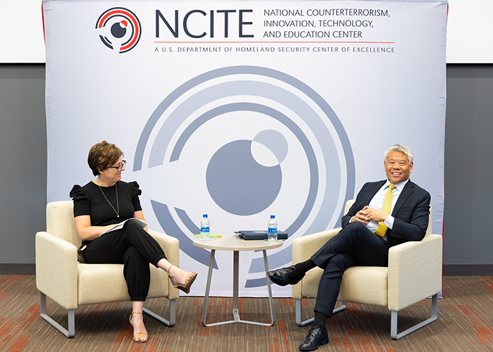 NCITE conference conversation with man and woman on stage