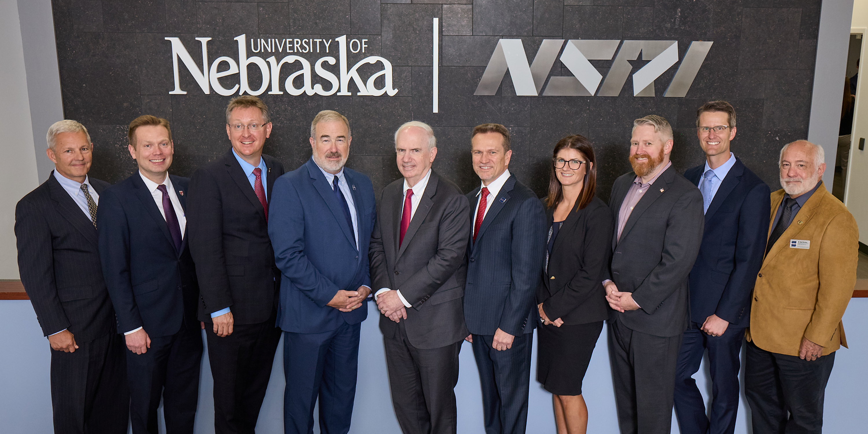 Group photo of researchers in front of NSRI/NU logo