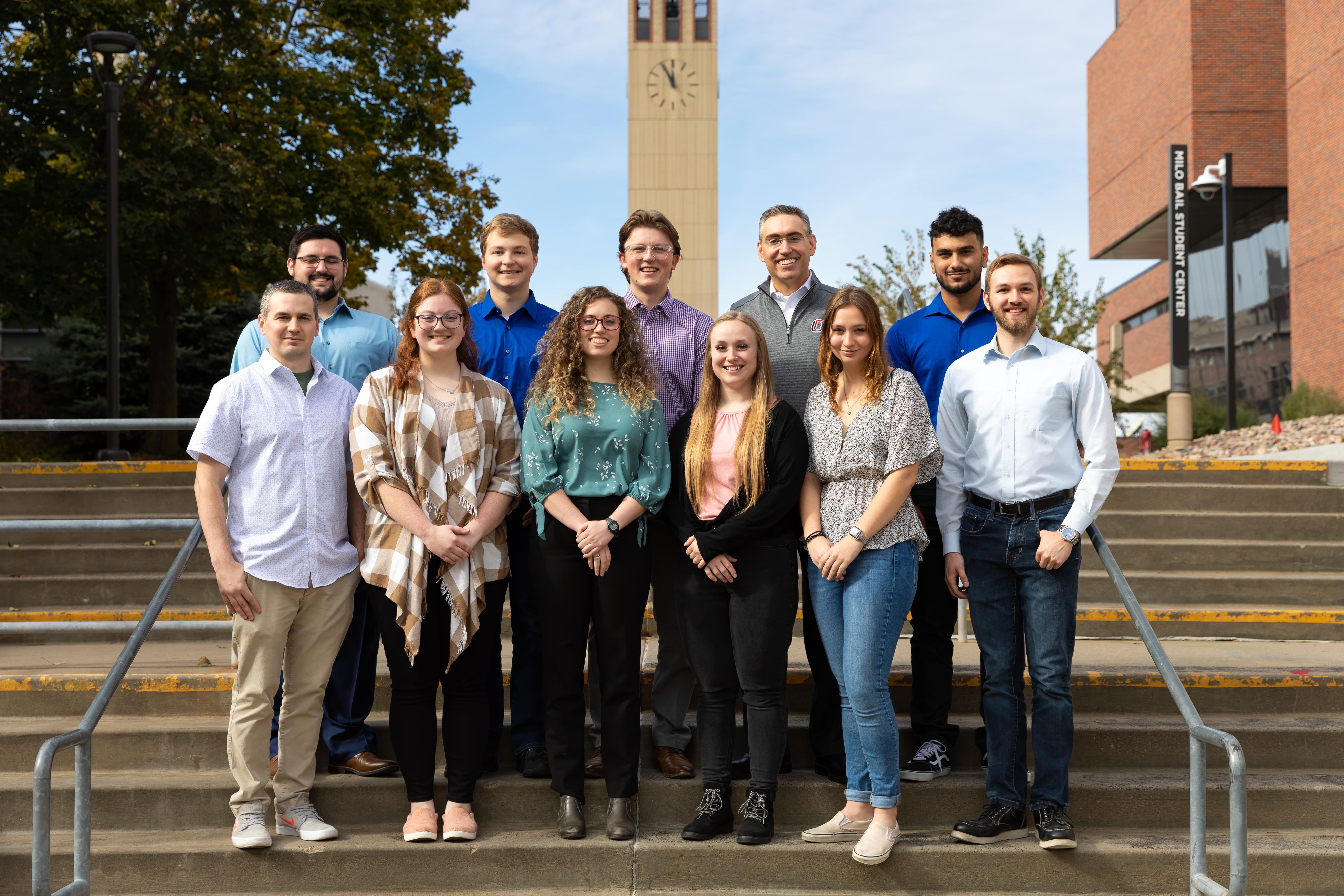 Dr. Davis standing with his student researchers.