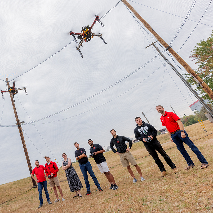 Team of eight researchers flying a drone