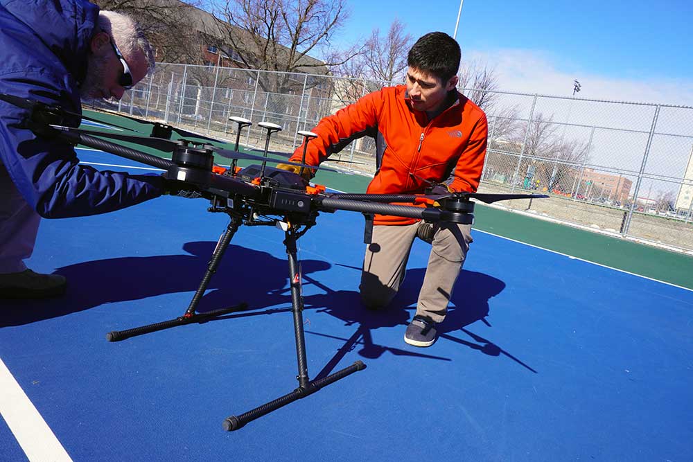 Male scientist works on drone