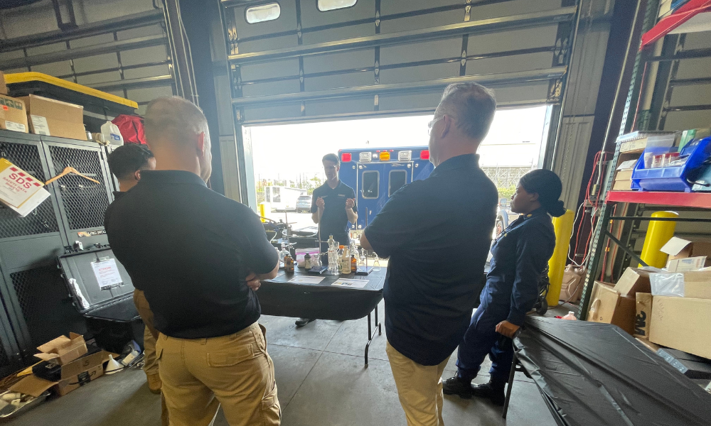 Dr. Thomas Mueller, NSRI research director for chemical defense programs, demonstrates various methods and glassware used in the manufacture of synthetic opioid processes. Ft. Hamilton, New York.