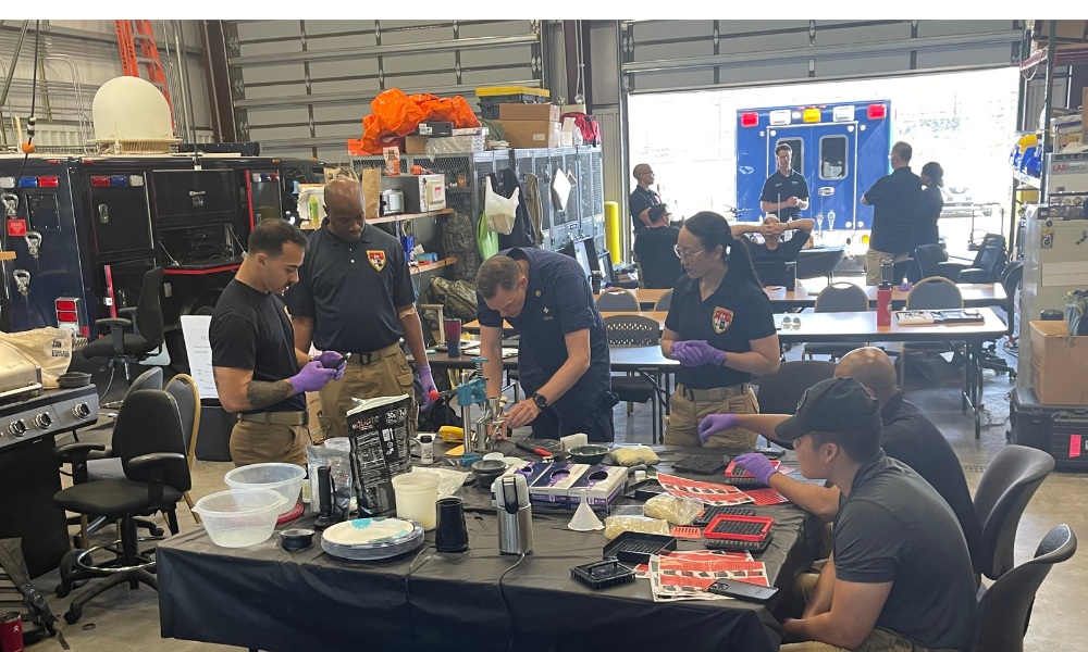 Course participants creating fentanyl pills in a mock pill laboratory.