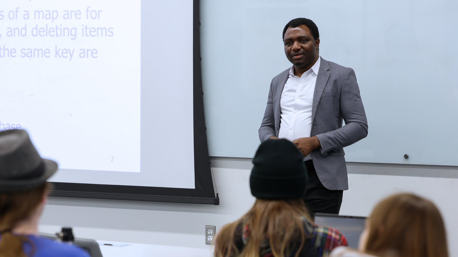 Professor teaching in college classroom