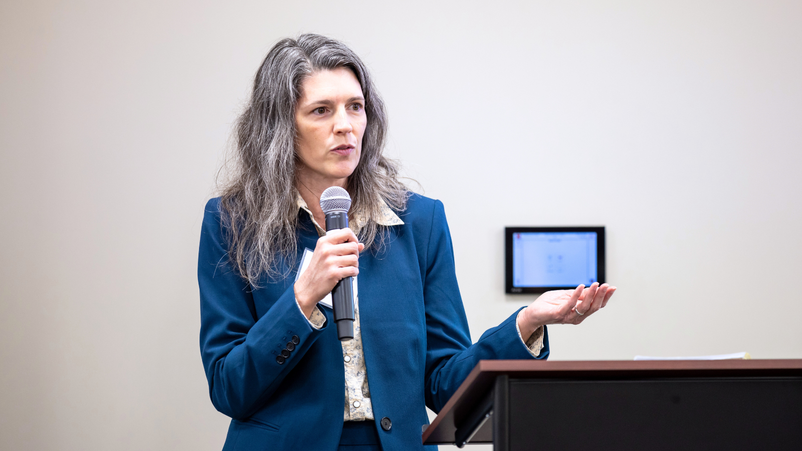 Female researcher presenting at Conference breakout session