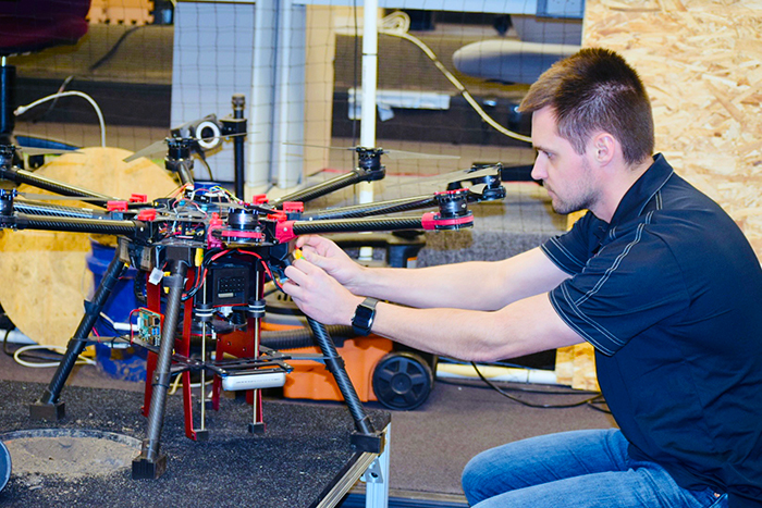 student working on large drone