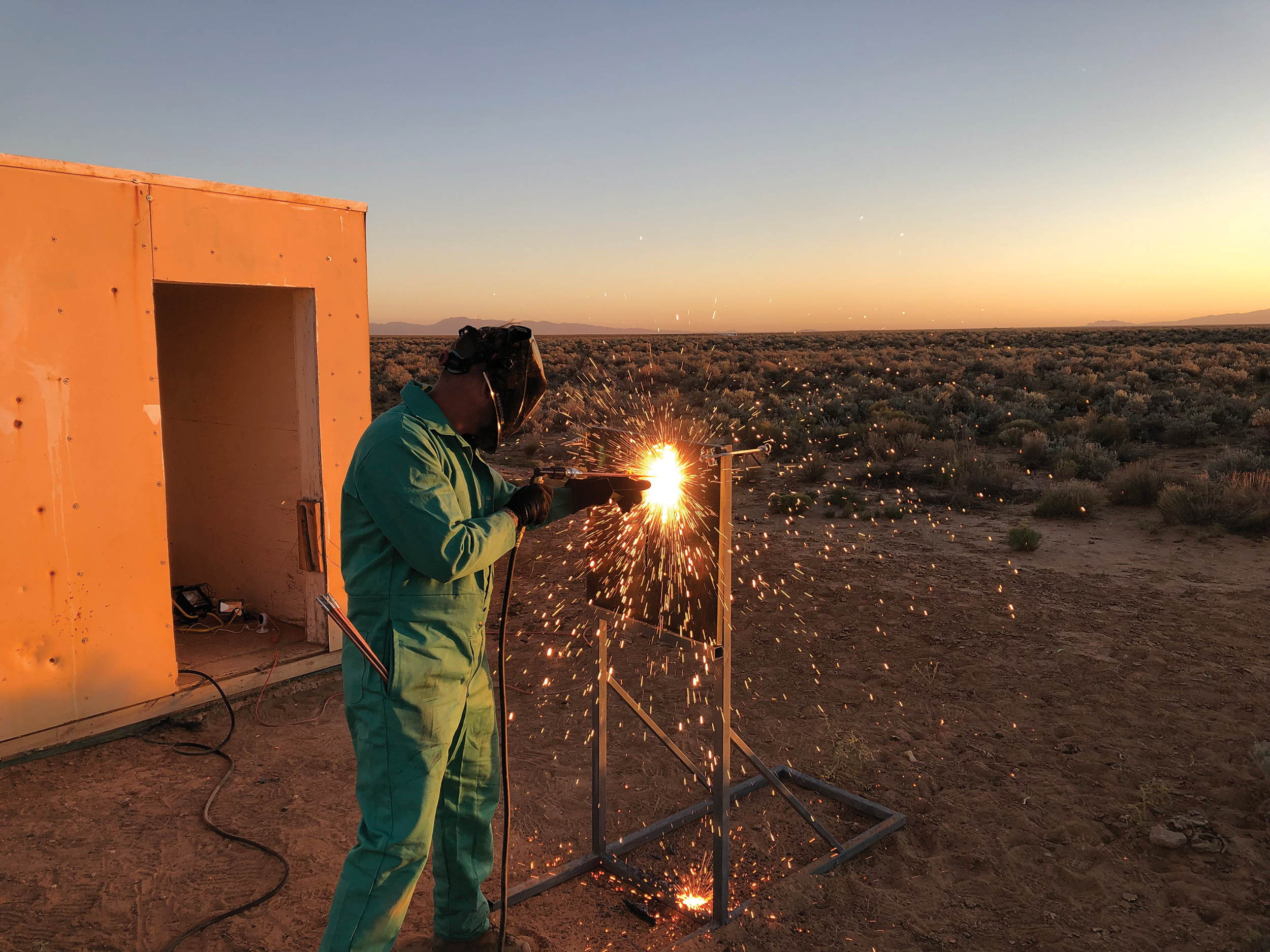 operator in full gear using cutting torch