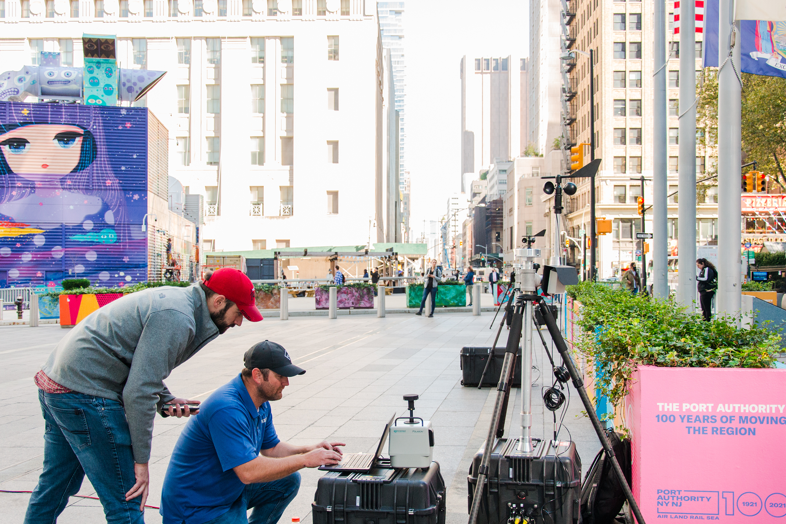 Researchers looking at device screen in NYC