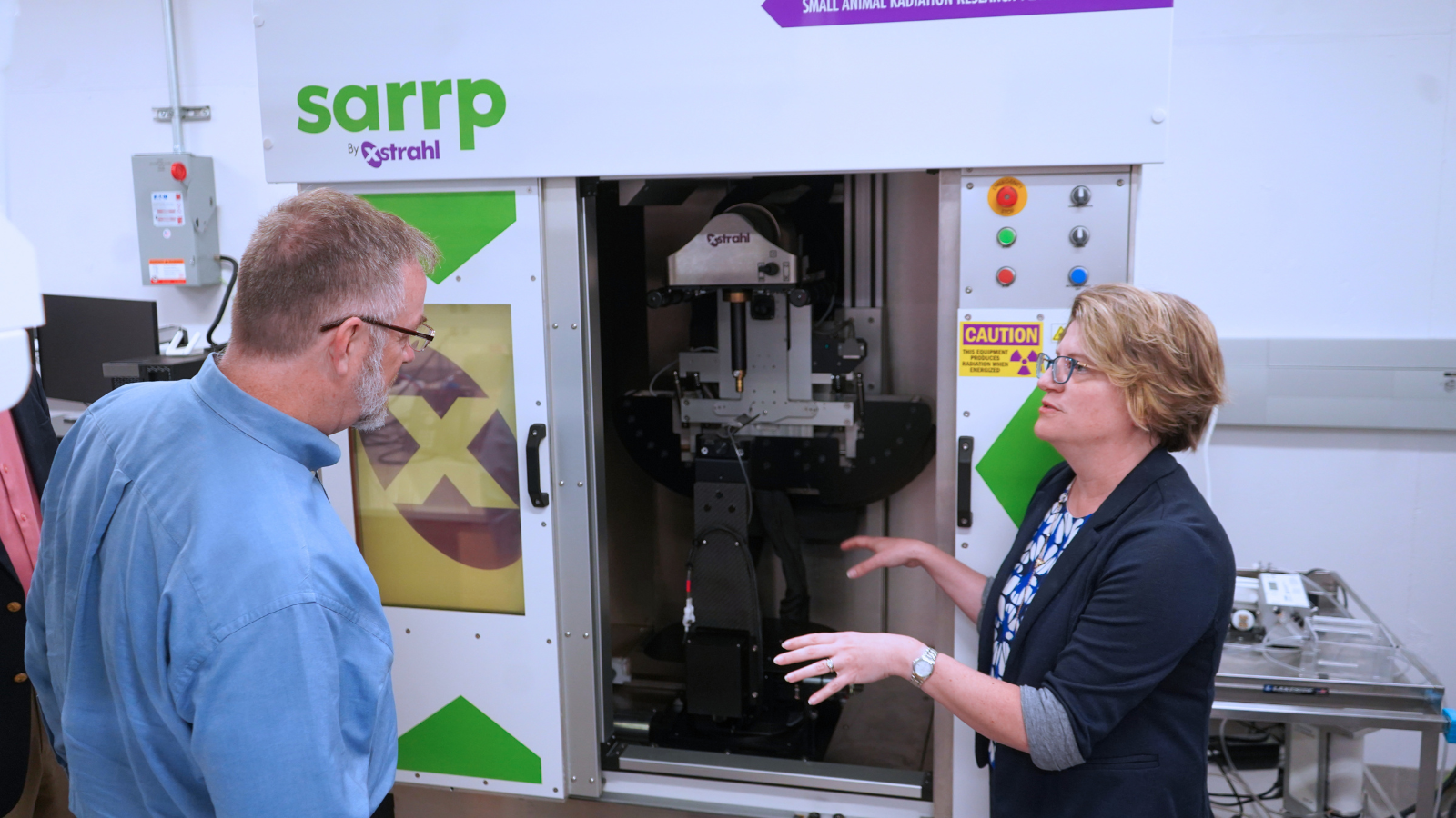 Dr. Rebecca Oberly-Deegan, professor in the UNMC Department of Biochemistry and Molecular Biology, shows the recently installed X-ray chamber, which represents a $200,000 investment by DHA in the testing capabilities at UNMC.