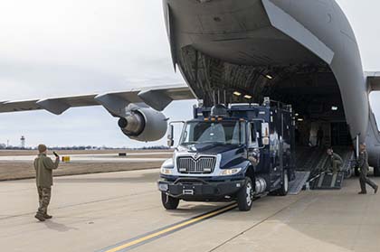 Box truck being delivered from Airplane on a runway
