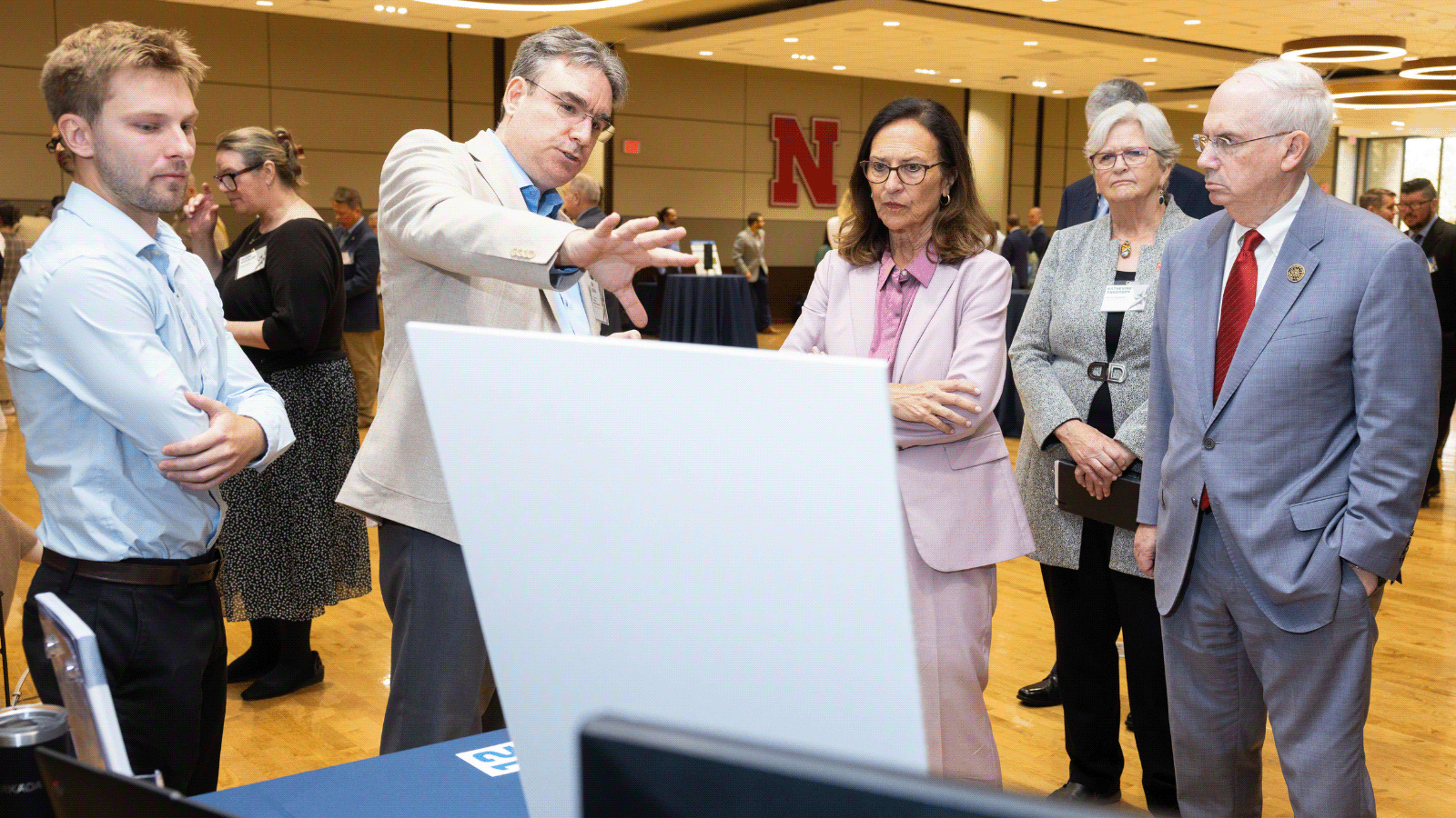 U.S. Senator Deb Fischer (middle) discusses unique capabilities and solutions with Can Vuran (second from left), Dale M. Jensen Chair Professor in the UNL School of Computing and director of the Cyber-Physical Networking Lab.