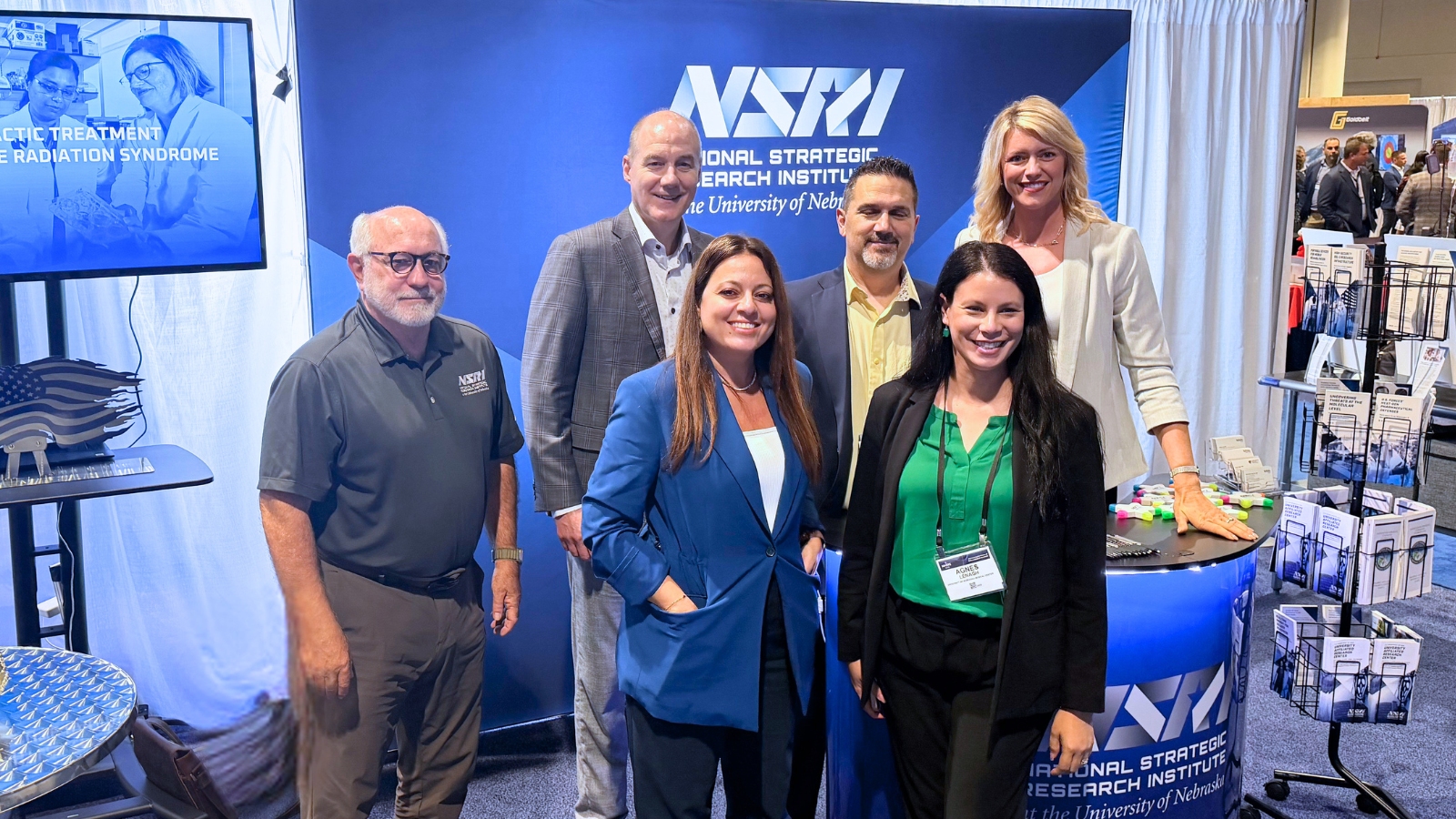 NSRI staff and NU faculty stand behind their booth at MHSRS  