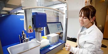 scientist using mass spectrometer
