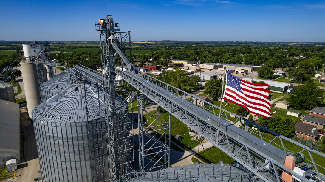 An American flag waves over a Frontier Co-op grain elevator in Ceresco, Nebraska.