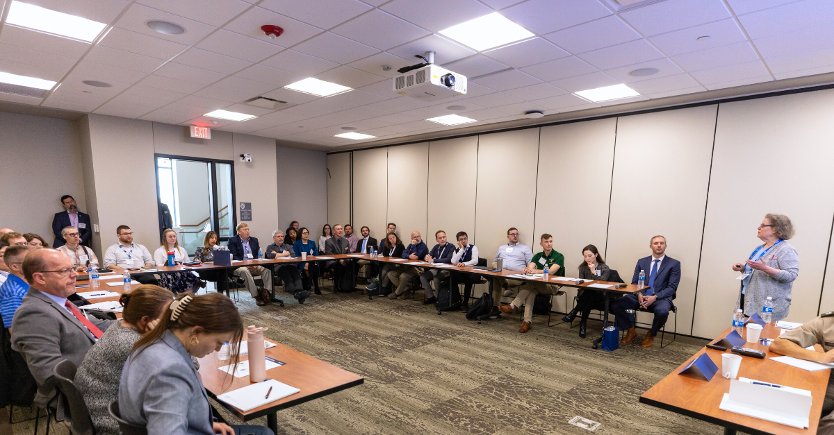 Researcher presents at breakout session of conference